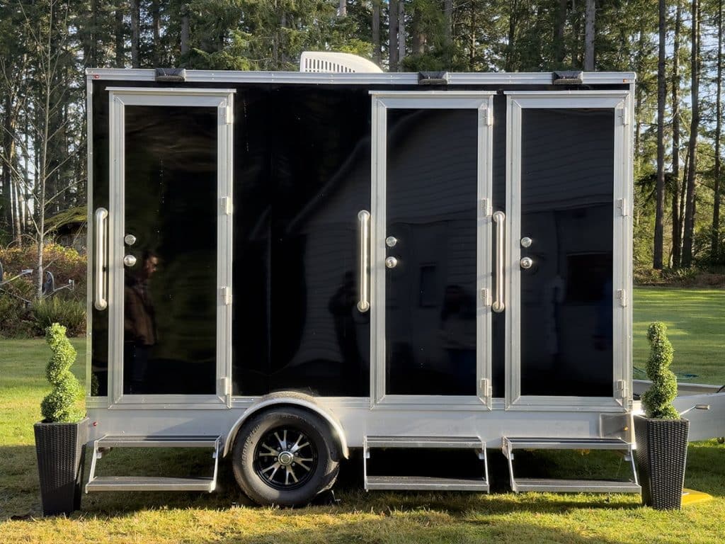 Three-stall portable restroom trailer.