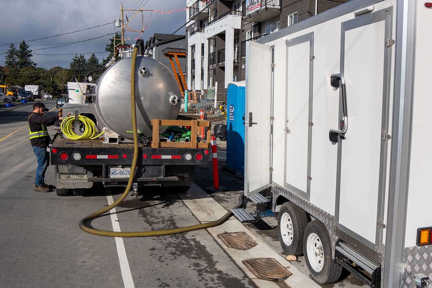 Truck with equipment on the street.