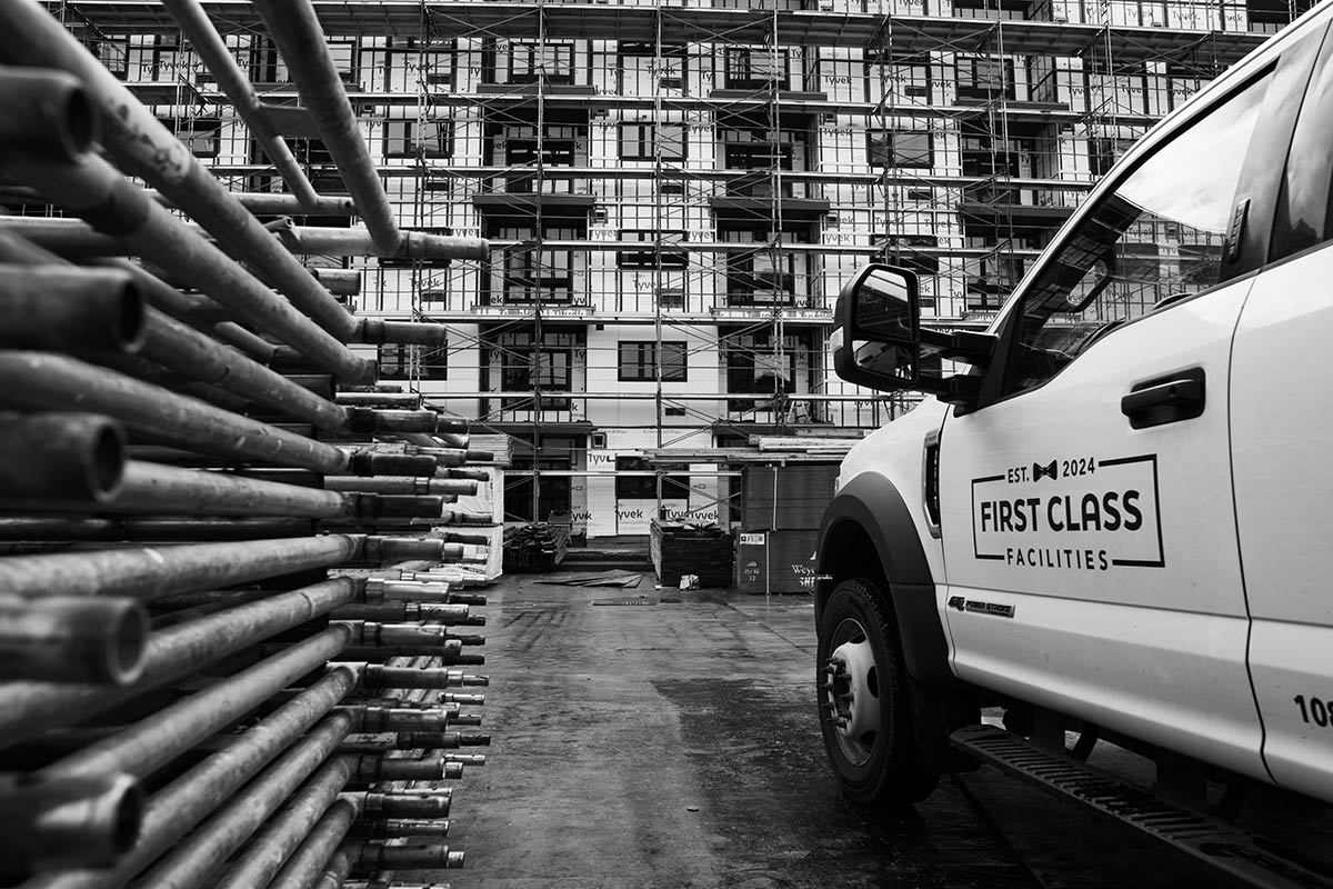 Construction site with company truck.